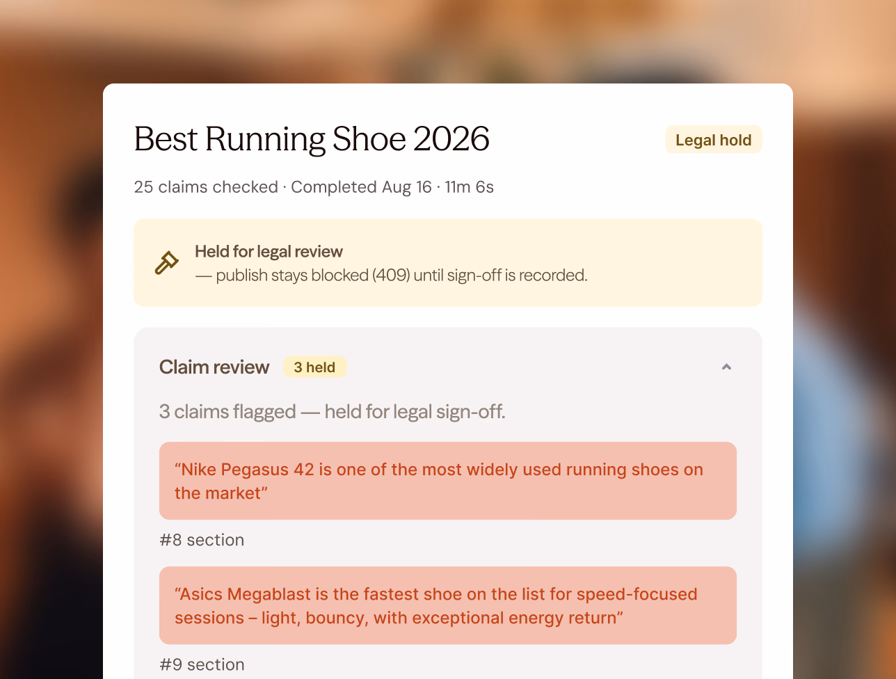A “Best Running Shoe 2026” run on legal hold: 25 claims checked, publishing blocked until sign-off, and a claim review flagging two product claims with the sections they sit in.